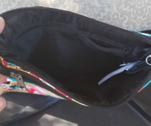 The inner pocket and opening inside the Disney World purse.