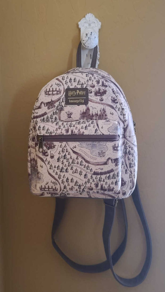 A Hogwarts mini backpack hung from a hook