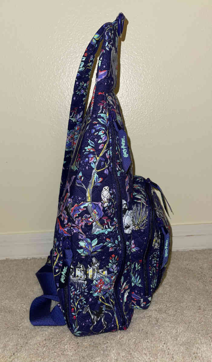 Side vew of my Vera Bradley Forbidden Forest sling backpack packed with stuff