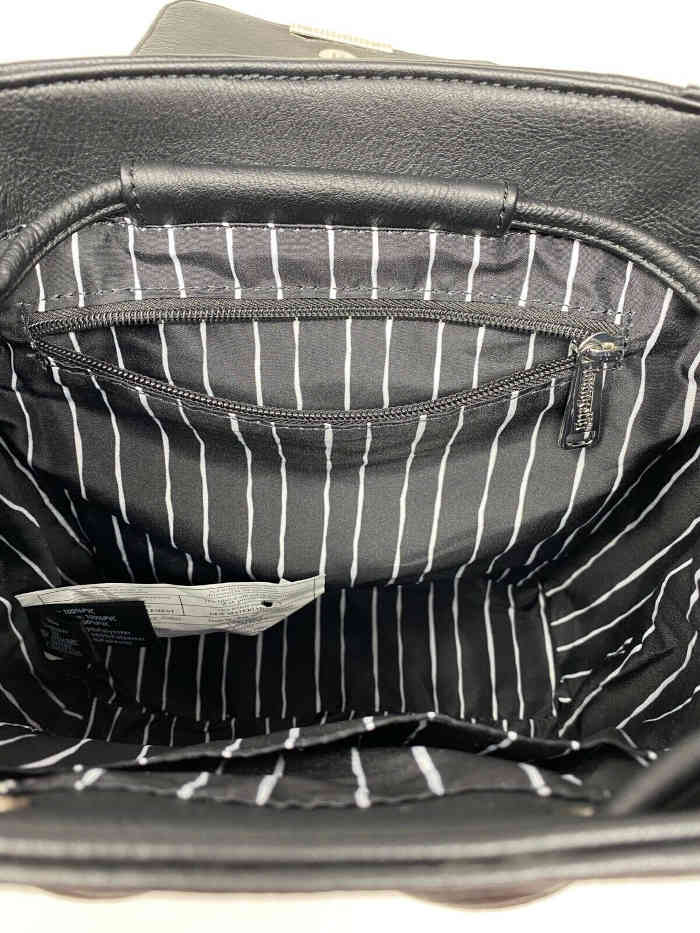 Inside pockets of the Jack Skellington convertible mini backpack