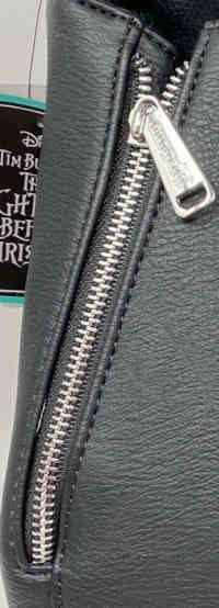 Zipper on the Jack Skellington convertible mini backpack